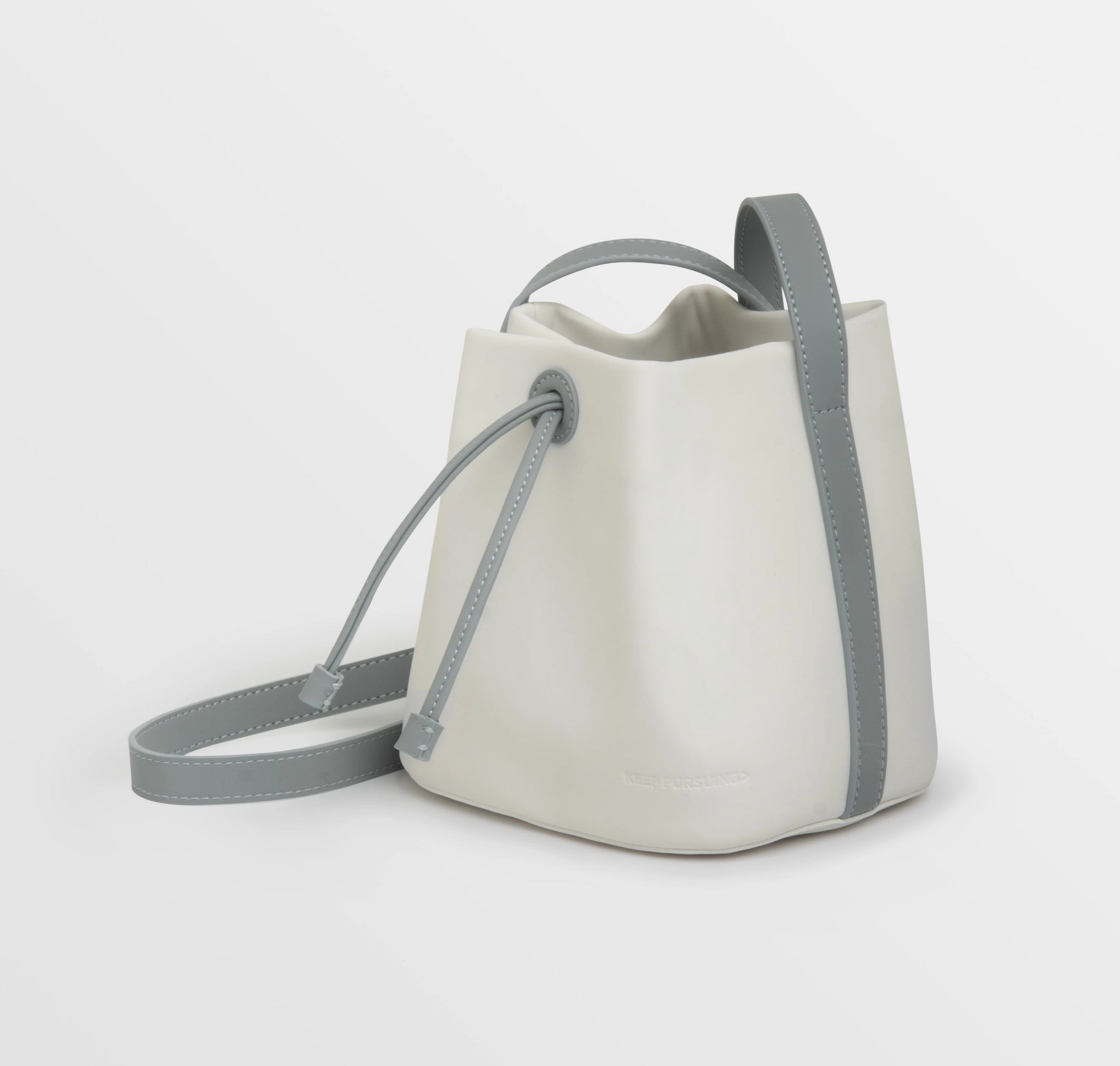 Emirates - Plane cut-out bucket bag. This edgy bucket bag is made from  leather-like PU material with cut-outs in the shape of planes to express  your love of travel.
